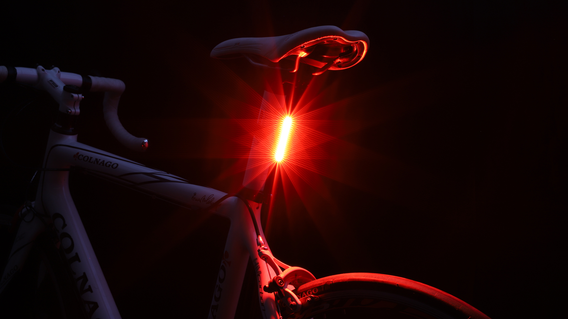 Cygolite Hotrod taillight glowing red on a road bike seatpost