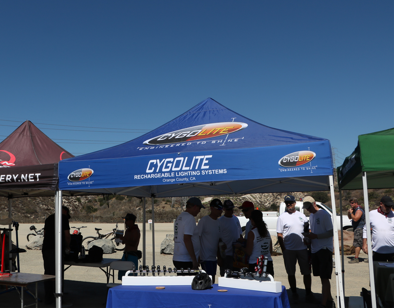 Cygolite team and bicycle lights at an outdoor cycling event